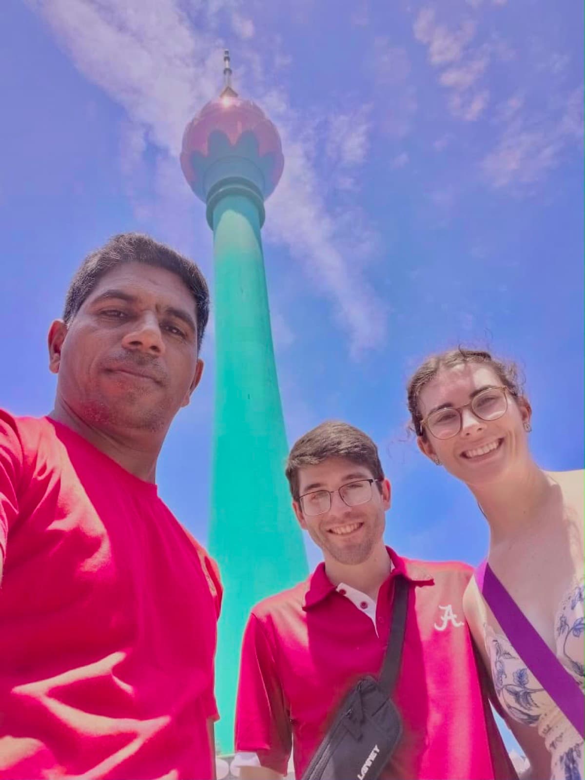 David with guests at the foot of the Lotus Tower
