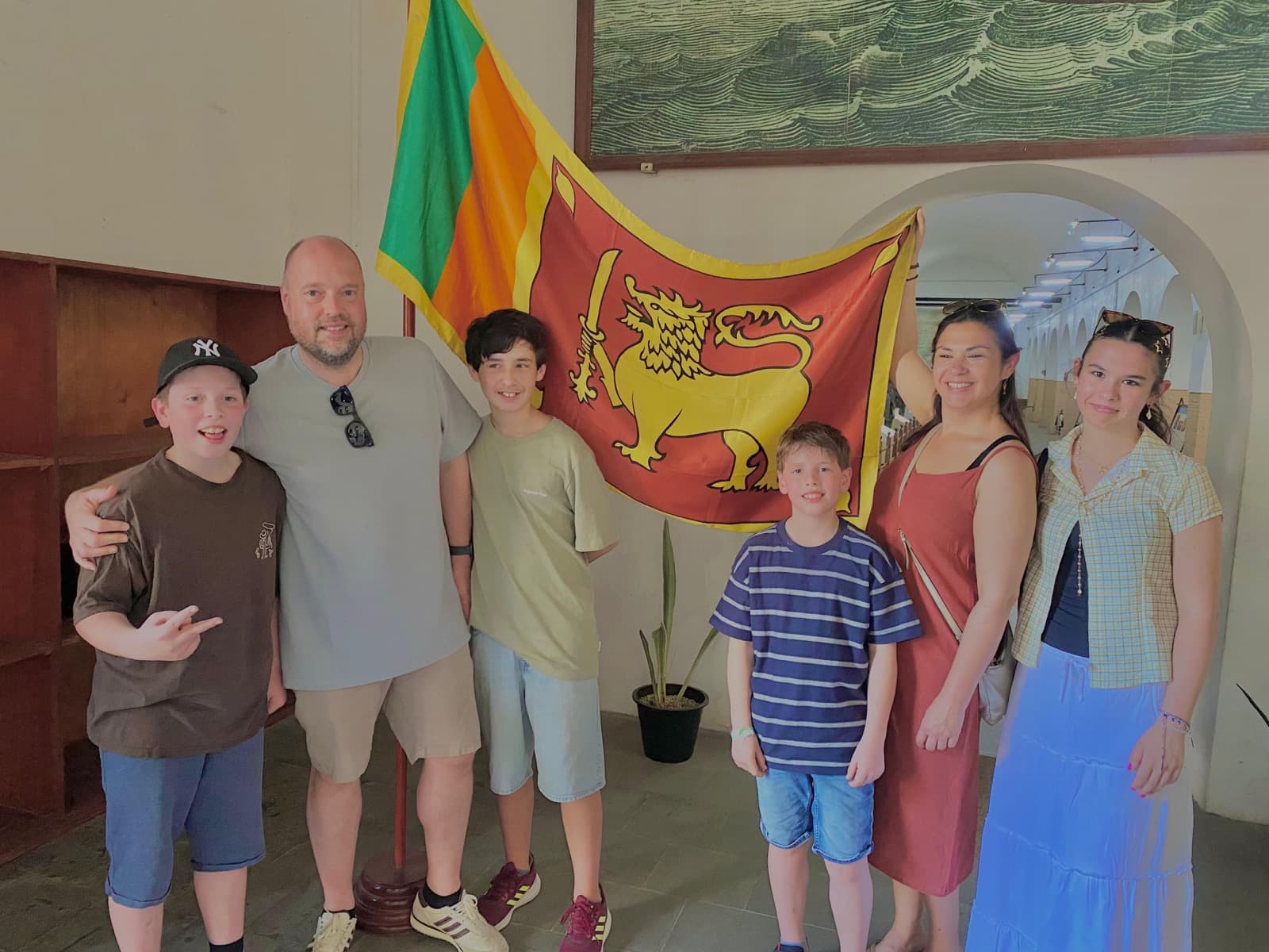 Family holding the Sri Lankan flag at the National Museum