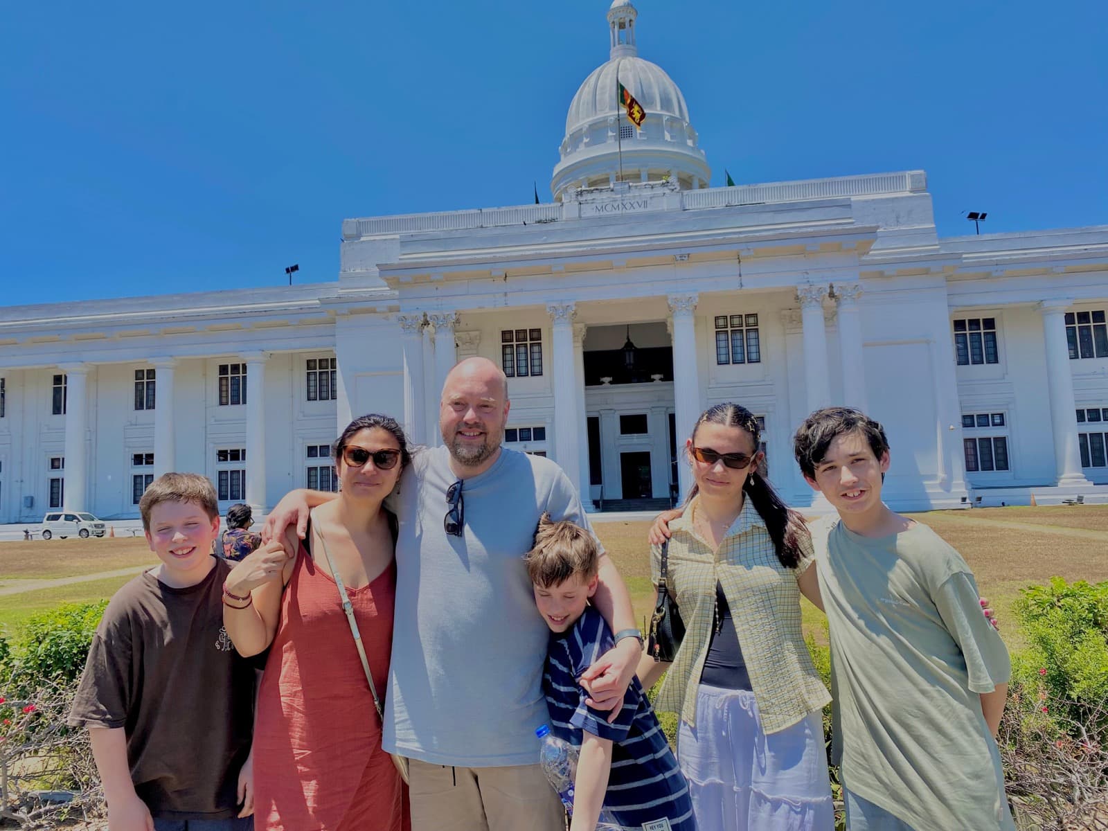 Family in front of the white-domed Colombo Town Hall