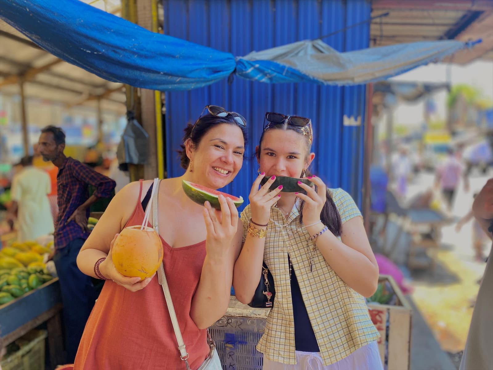 Guests tasting fresh watermelon at a Colombo market